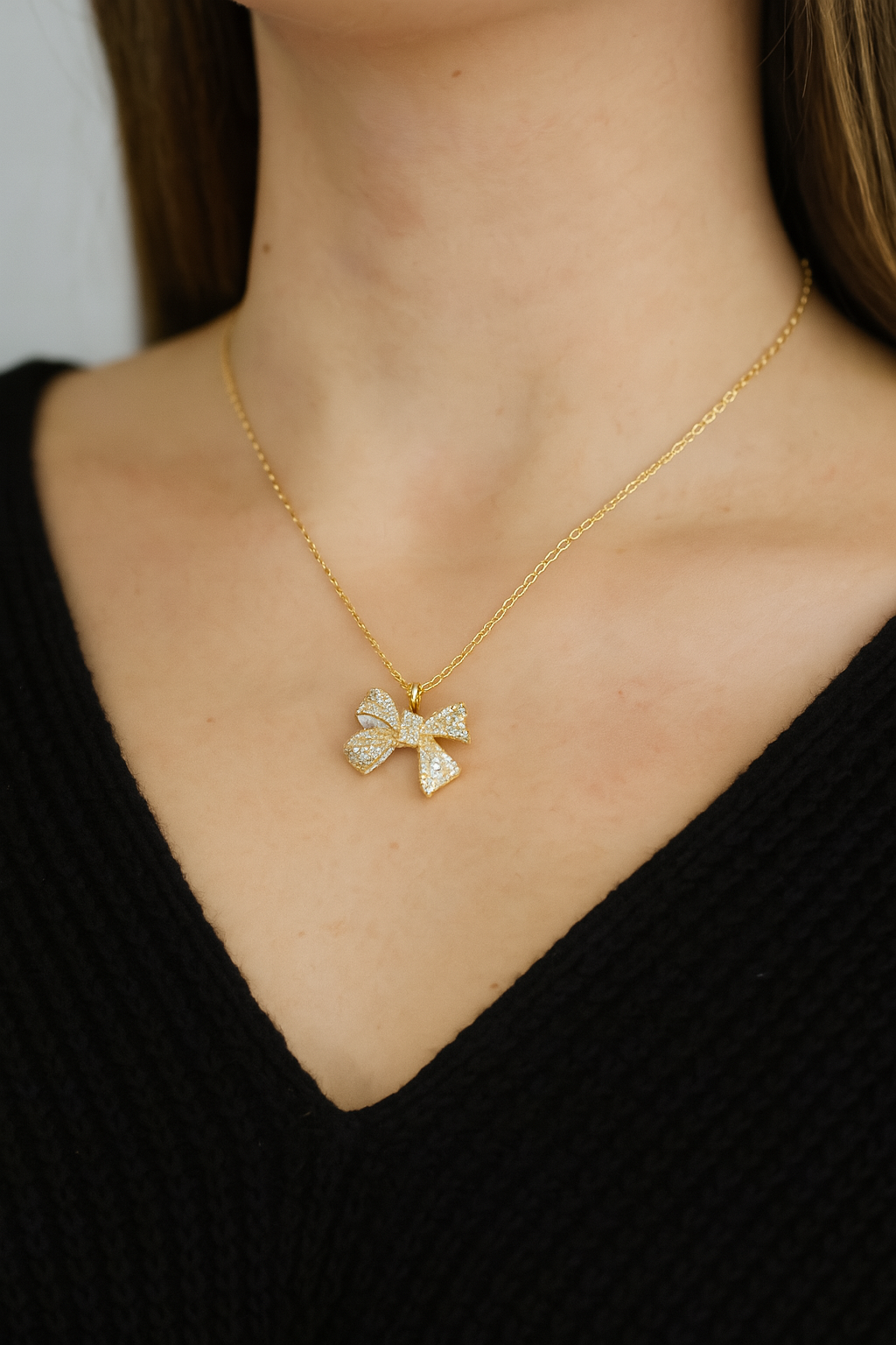 Radiant Gold Ribbon Pendant Necklace