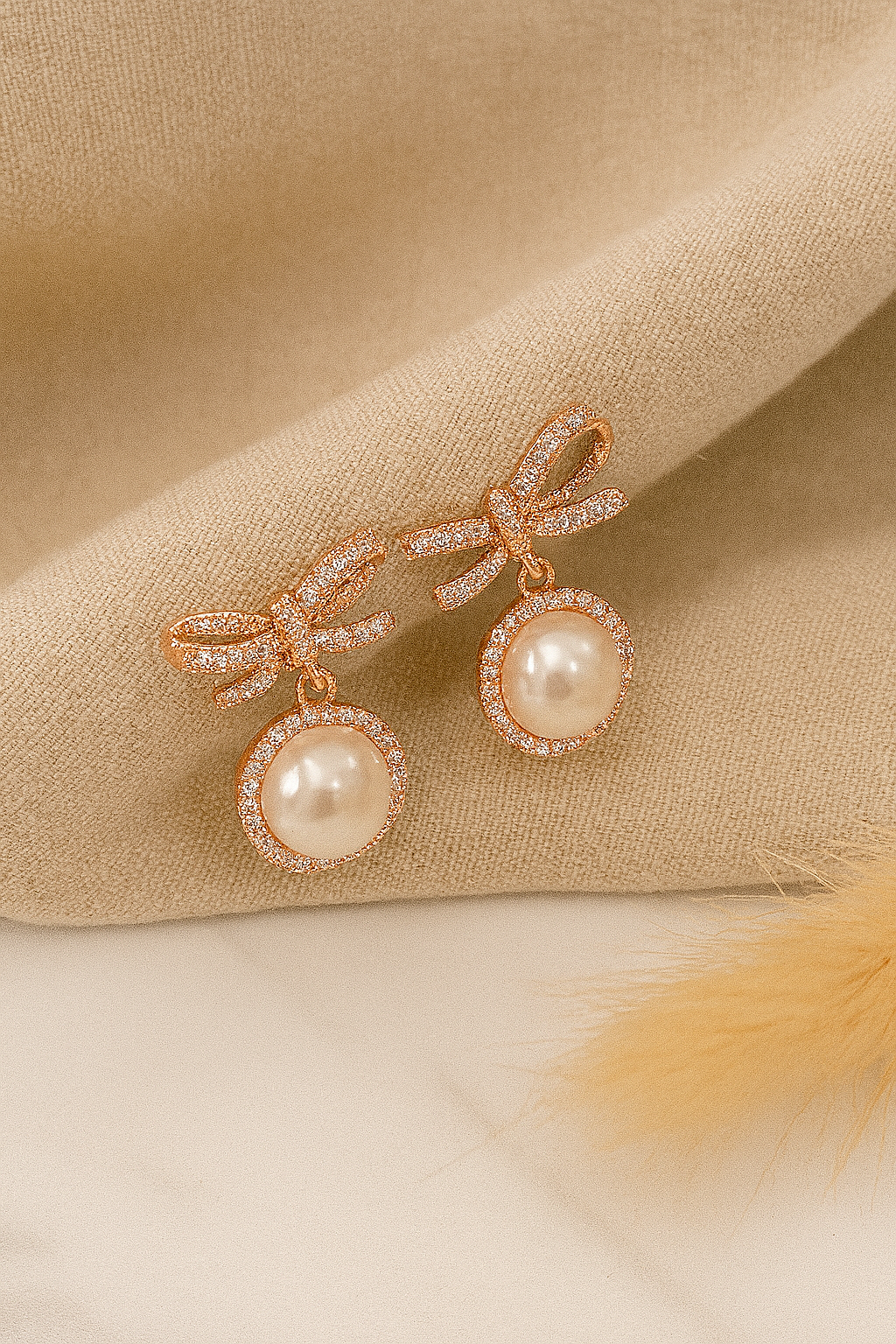 A Classic Twisted Bow With Rose Gold Touch Earrings