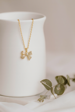 Radiant Gold Ribbon Pendant Necklace